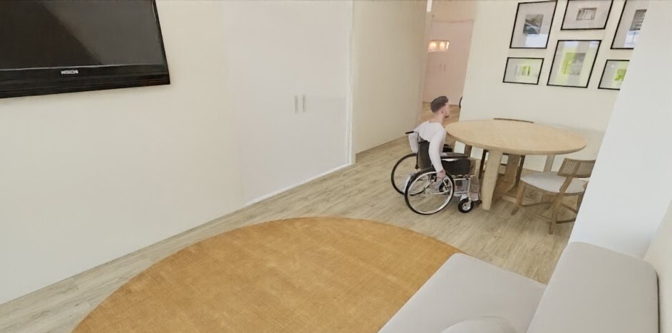 Recreación del interior de la casa donde se ve una persona desplazándose en silla de ruedas