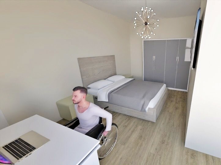 Recreación del interior de la casa donde se ve una persona desplazándose en silla de ruedas